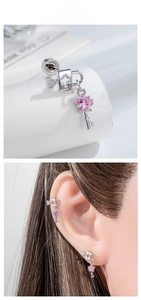 Macro detail of silver lock and key stud earrings with a pink star crystal stone