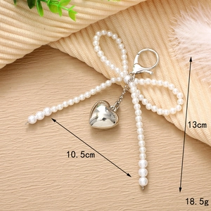 Silver heart and pearl bow keychain pendant for bags with size and weight details