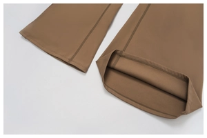 Detailed view of the brown fleece yoga jumpsuit showing high-quality hem stitching