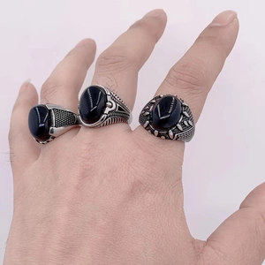 Vintage men's titanium steel rings with oval black gemstones and engraved textures