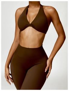 Detail of dark brown knot-front sports bra and high-waisted leggings set