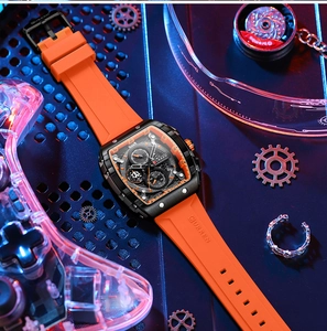 Detail of waterproof quartz chronograph watch with orange silicone strap on a blue background