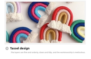 Macro shot of handmade woven rainbow charms with white fringe tassels and colorful cotton rope