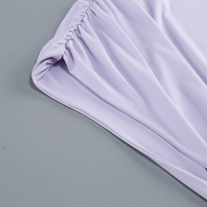 Detailed macro view of the lavender fabric with intricate pleated textures and elastic finish