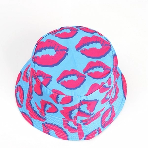 Close-up of bright blue bucket hat with pink lip patterns and detailed brim stitching