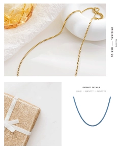 Detail view of gold and blue box chain necklaces with premium metallic plating and shine