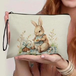 Off-white canvas Easter bunny makeup bag with hand-painted rabbit and egg print