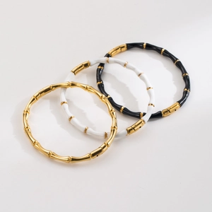 Chic bamboo-style stainless steel bracelets with enamel inlay in gold black and white colors