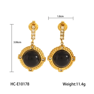 Detail view of French retro obsidian earrings with 18k gold plating and clear zircon studs