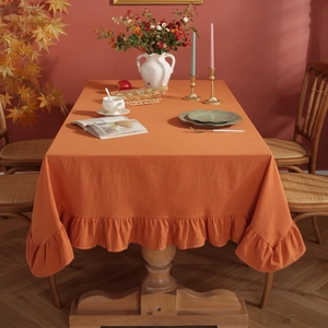 Pumpkin orange cotton tablecloth with ruffled edges for festive autumn dining table decor