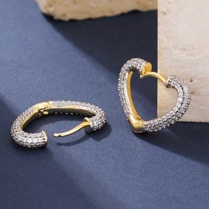 Luxurious gold heart-shaped hoop earrings with sparkling pave-set cubic zirconia crystals