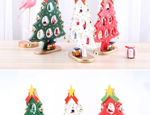 Detail of wooden Christmas tree decor with small painted ornaments and golden bells