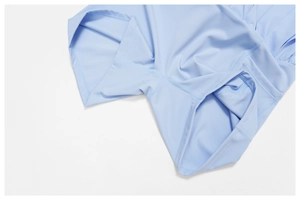 Flatlock stitching detail on light blue athletic pleated tennis skirt with built-in liner
