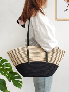 Women's woven tote bag with contrast beige and black stripes and slim shoulder straps