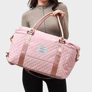 Pink quilted yoga fitness bag with large capacity and shoulder strap on model