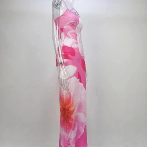 Detail of pink floral print on backless slit dress with slim fit tailoring