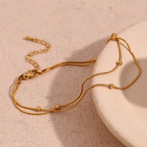 Double-layer 18K gold-plated snake chain bracelet with polished beads and lobster clasp