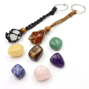 Detail of hand-woven yoga keychain net bags with assorted natural gemstones and beads