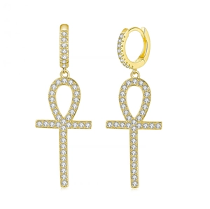 Detailed macro view of gold-plated Ankh cross earrings with cubic zirconia pave
