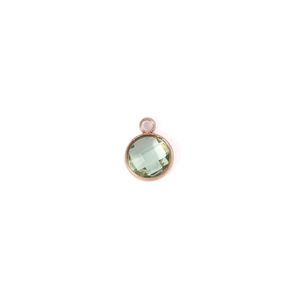 Macro detail of 7mm green faceted birthstone pendant with rose gold plated setting