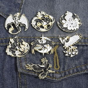 Japanese manga style black and white mythical beast enamel pin set with gold metal trim