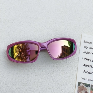 Detail of purple-pink metallic sports sunglasses with colorful reflective mirror lenses