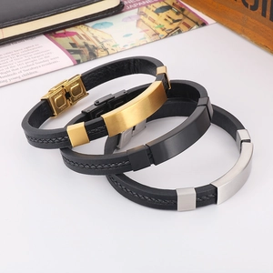 Detail of stainless steel clasp and braided leather texture on men's fashion bracelet
