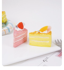 Realistic triangle mousse cake squishy toy with strawberry and lemon cream textures
