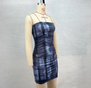 Detail of blue and purple tie-dye bodycon dress featuring ruched side and stretch fabric