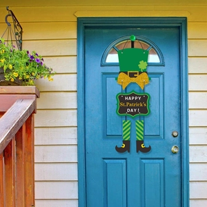 Macro view of St. Patrick's Day door hanger with gnome, shamrocks and gold bow detail
