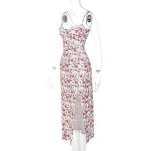 Detail of floral slip dress featuring delicate white lace trim and pink rose patterns