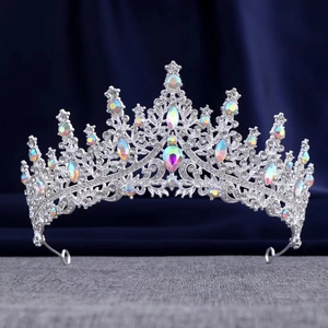 Close-up of silver bridal crown with iridescent AB crystals and teardrop rhinestones