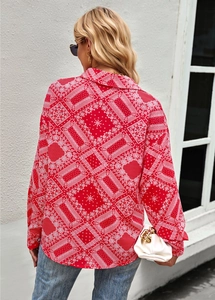 Back view of a red paisley long sleeve shirt with classic white bandana pattern