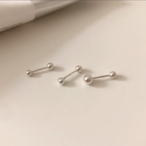 Three-piece 925 sterling silver barbell stud earrings with round spheres on white background