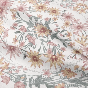 Close-up of bohemian floral tapestry with pink and yellow retro botanical patterns