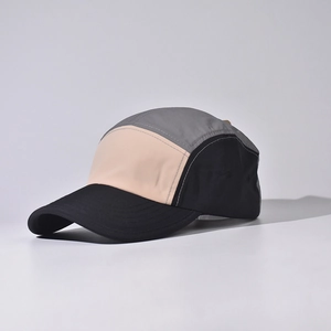 Detailed side view of 5-panel outdoor baseball cap featuring a tricolor patchwork design