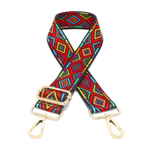 Detail of colorful geometric ethnic style woven bag strap with golden metal clasps