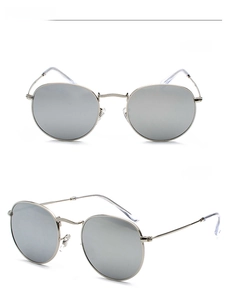 Detailed views showing the front and 45-degree angle of silver metal round sunglasses