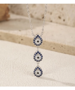 Detail of S925 silver necklace featuring three blue and clear crystal drop pendants