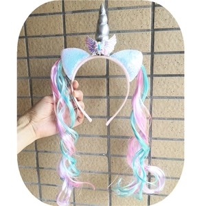 Unicorn headband detail featuring sequined ears, silver horn and long pink-blue curly wig hair