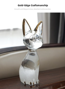 Detail of golden gilded edges on a cat-shaped weather storm glass bottle crystal