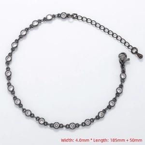 Detail of 4mm tennis bracelet featuring round cubic zirconia and lobster clasp with chain