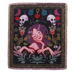 Black bohemian woven camping blanket with artistic pink floral motifs and Femme text