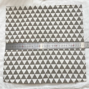 Detailed view of grey triangle pattern cotton linen pillow cover showing 45cm size with ruler