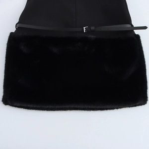 Detailed close-up of faux fur trim and narrow black belt with silver metal buckle