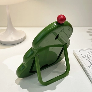 Green wavy desktop makeup mirror with foldable stand and red decorative ball