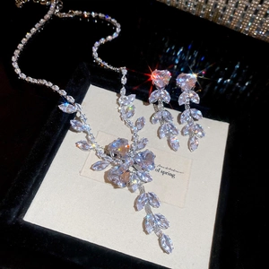 Macro shot of zircon flower jewelry set with sparkling heart stones in a gift box