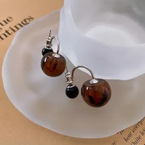 Vintage leopard print round cherry style earrings with silver pins on matte glass