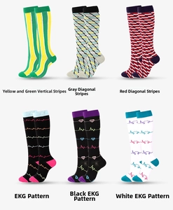 Detailed close-up of six athletic compression socks featuring stripes and EKG heart patterns