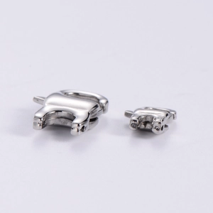 Close-up of polished stainless steel lobster clasps in two sizes on white background